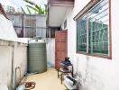 Outdoor area with water storage tank and utility equipment