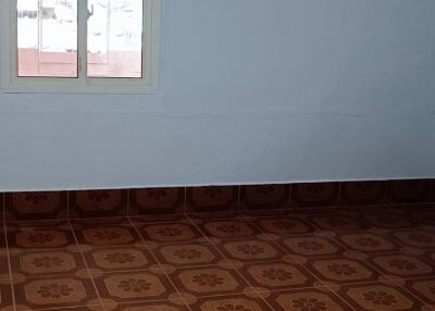 Empty room with tiled flooring