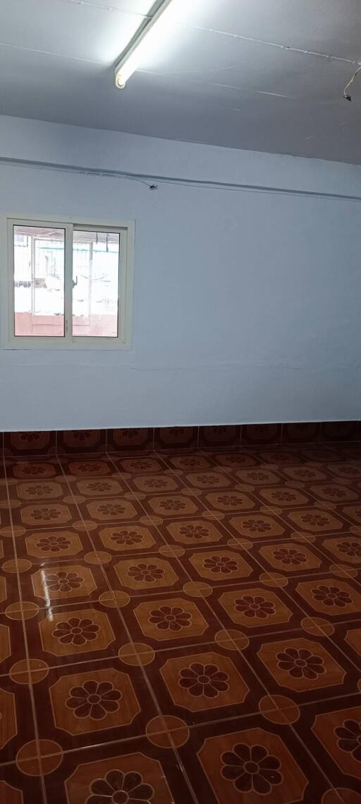 Empty room with tiled flooring