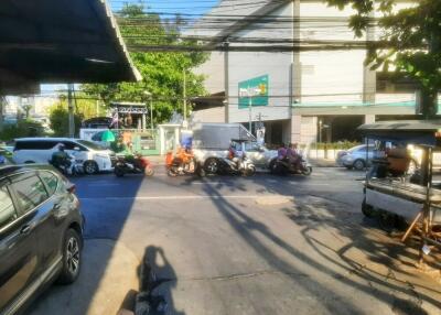 Street view with vehicles and buildings