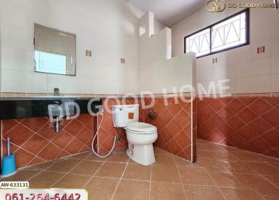 Modern bathroom with tiled walls and floor