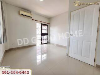 Spacious bedroom with air conditioning and large window