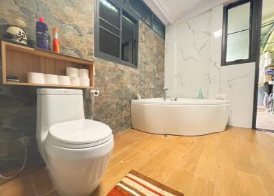 Modern bathroom with bathtub and toilet