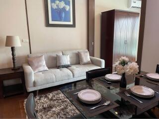 A well-furnished living room with a dining area