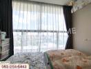 Bedroom with large windows and natural light