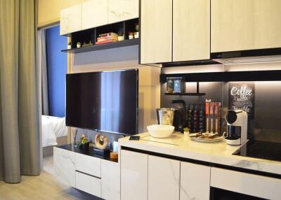 Modern kitchen with white cabinets and black countertop