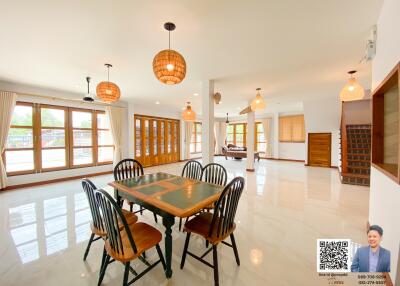 Spacious dining area with large windows and modern decor