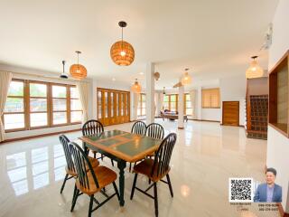 Spacious dining area with large windows and modern decor