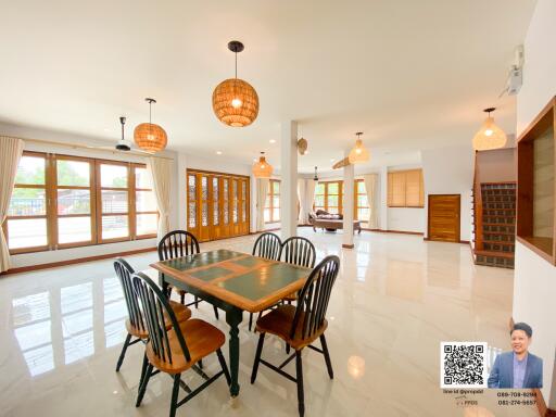 Spacious dining area with large windows and modern decor