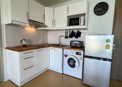 Modern kitchen with white cabinets and appliances