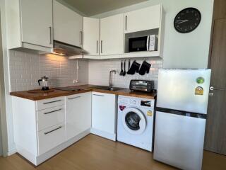 Modern kitchen with white cabinets and appliances