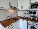 Modern kitchen with wooden countertop and appliances