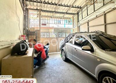 Garage with parked car and motorcycles