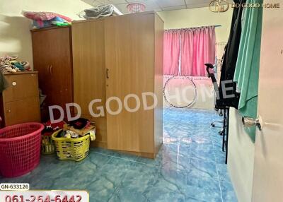 Bedroom with wardrobes and tiled floor