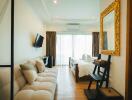 Modern bedroom with a bed, sofa, and wall-mounted TV