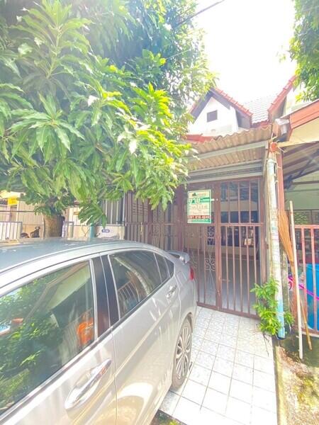 Exterior view of a house with a car parked in the driveway