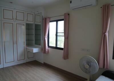 Bedroom with wardrobe and window