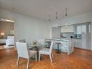 Modern open dining area with kitchen and bedroom