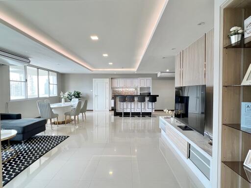 Modern open-plan living room with kitchen and dining area