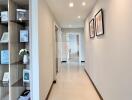 Bright hallway with built-in shelving and tiled floor