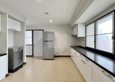 Modern kitchen with appliances and ample storage space