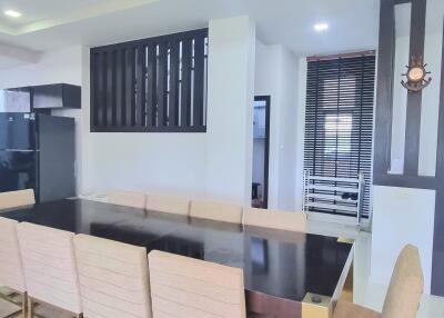 Modern dining area with large table and chairs