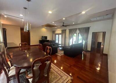 Spacious living room and dining area with abundant natural light