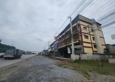 Exterior view of a multi-story building along a road