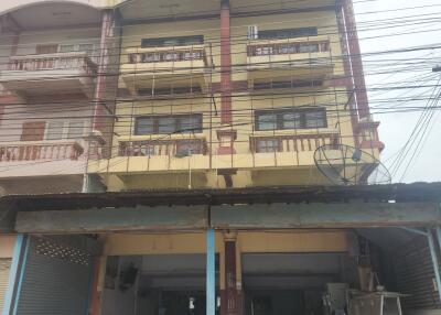 Four-story residential building with balconies