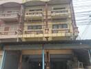 Four-story residential building with balconies