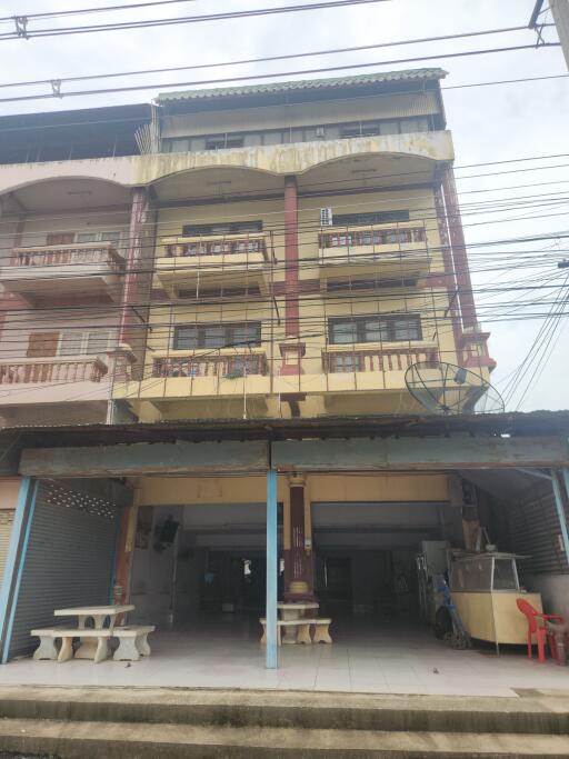 Four-story residential building with balconies