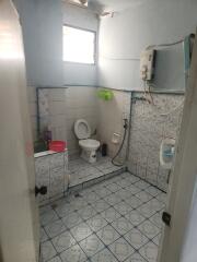 Basic bathroom with tiled floor and walls