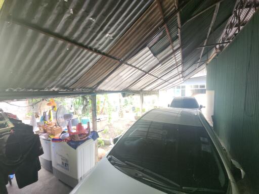 Carport with vehicles