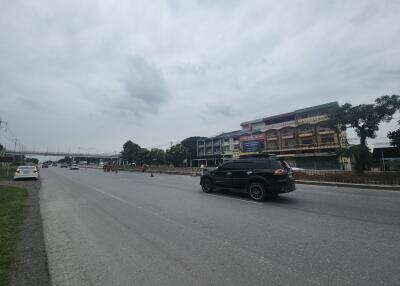 View of a road with vehicles and buildings