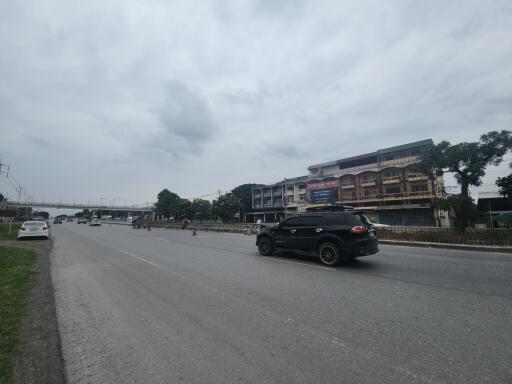 View of a road with vehicles and buildings