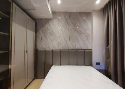 Modern bedroom with wardrobe and bed