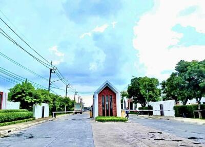 Gated community entrance with security post