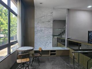 modern common area with seating and marble design