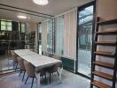 Modern dining area with large windows, blinds, and an elegant dining table