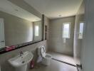 Modern bathroom with large walk-in shower and white fixtures