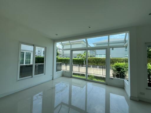 Spacious living room with large windows and natural light