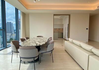 Modern living and dining area with city view