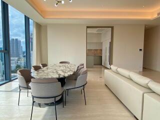 Modern living and dining area with city view