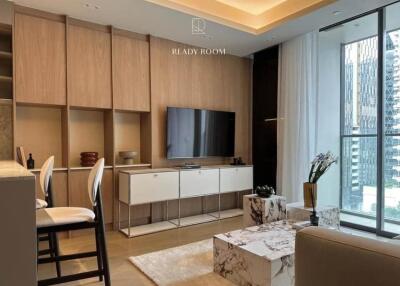 Modern living room with wooden cabinetry and large windows