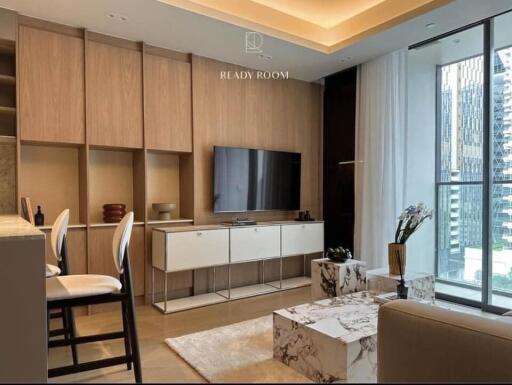 Modern living room with wooden cabinetry and large windows