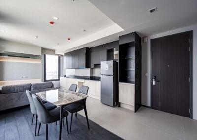 Modern open-plan living area with kitchen and dining space