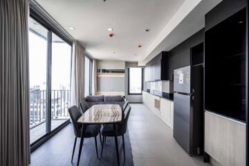 Modern kitchen and dining area with large windows and balcony