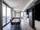 Modern kitchen and dining area with large windows and balcony