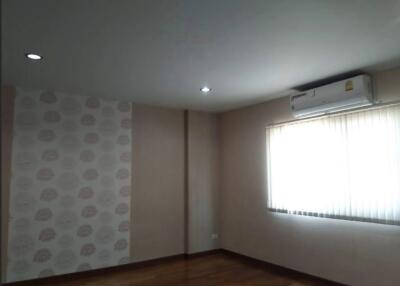 Spacious living room with a window and air conditioning unit