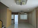 Living room with modern ceiling light, tiled floor, and stairs